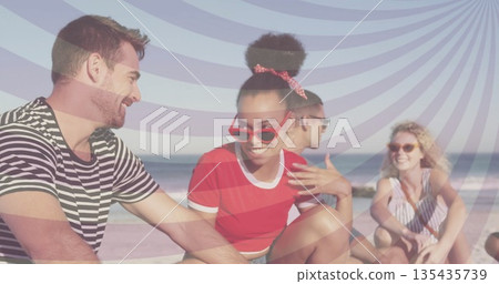 Talking friends wearing summer wear and sunglasses on sandy beach, wearing red cat-eye glasses 135435739