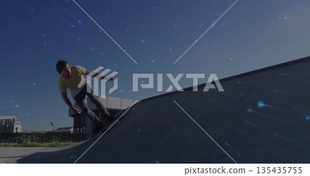 Man in yellow shirt skateboarding on ramp at skatepark, with skateboard, sparkling sky, copy space Man in yellow shirt skateboarding on ramp at skatepark, with skateboard, sparkling sky, copy space 135435755