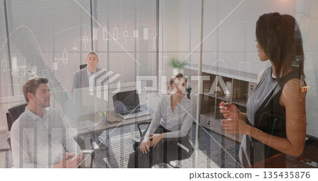 Presenting businesswoman writing on glass board in office meeting with laptop, copy space 135435876