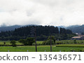 Deep forest and summer countryside of Tokamachi shrouded in mist Morning in Satoyama with a steel tower 135436571