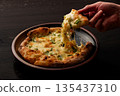 "Freshly baked pizza with stretchy cheese" 135437310