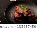 Spare ribs with red wine sauce 135437450
