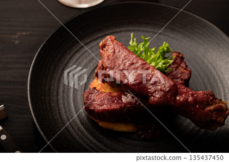 Spare ribs with red wine sauce 135437450