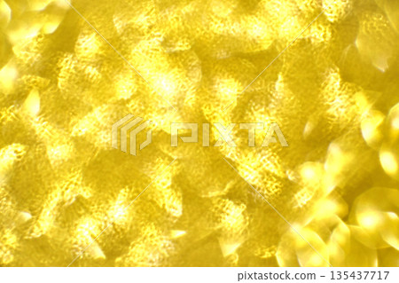 Abstract gold light pattern with shimmering textures and soft yellow glow Abstract gold light pattern with shimmering textures and soft yellow glow 135437717