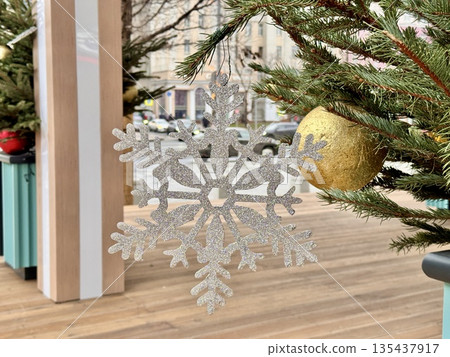 Bright Christmas Tree toys are hanging on the tree. New Year 135437917