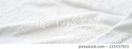 Soft white textured fabric close-up with gentle wrinkles and smooth surface Soft white textured fabric close-up with gentle wrinkles and smooth surface 135437953