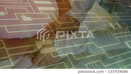 Palpating doctor's hands pressing patient's abdomen in examination room, with digital grid overlay Palpating doctor's hands pressing patient's abdomen in examination room, with digital grid overlay 135439096