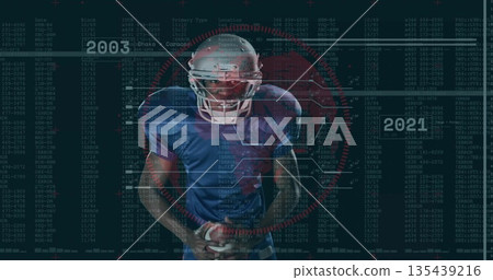 Gripping leather football, football player standing in code arena, with helmet facemask, red target 135439216