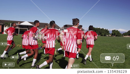 Running jersey teammates sprinting across school field, with cones, hurdles and digital icons Running jersey teammates sprinting across school field, with cones, hurdles and digital icons 135439229