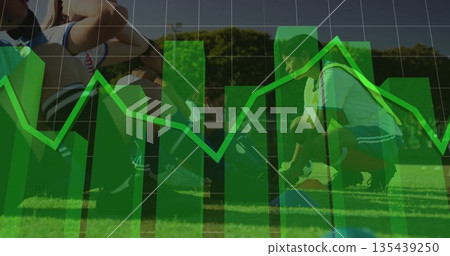 Six female soccer players gathering balls in jerseys on grass field, with green chart overlay 135439250