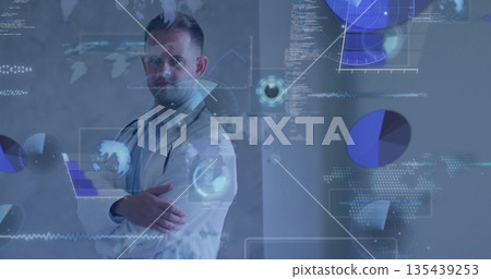 Standing adult male doctor crossing arms in office, with stethoscope, holographic data, copy space Standing adult male doctor crossing arms in office, with stethoscope, holographic data, copy space 135439253