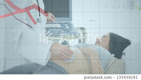 Performing ultrasound physician scanning patient on exam table in clinic with ultrasound machine 135439291