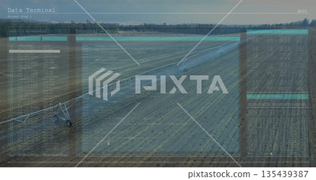Operating center-pivot irrigation system watering crop field at rural farm, with data overlay Operating center-pivot irrigation system watering crop field at rural farm, with data overlay 135439387