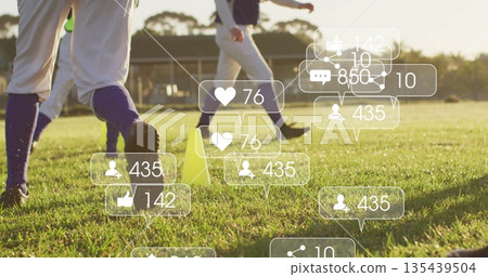 Practicing athletes in white trousers drilling footwork on grass with yellow cones social overlays Practicing athletes in white trousers drilling footwork on grass with yellow cones social overlays 135439504