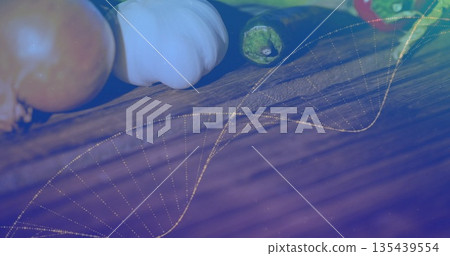 Displaying tomato, garlic, chili pepper on rustic countertop, showing bell pepper, dotted DNA helix Displaying tomato, garlic, chili pepper on rustic countertop, showing bell pepper, dotted DNA helix 135439554