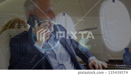 Talking traveler wearing navy blazer in jet cabin with smartphone, leather seats and oval window Talking traveler wearing navy blazer in jet cabin with smartphone, leather seats and oval window 135439574