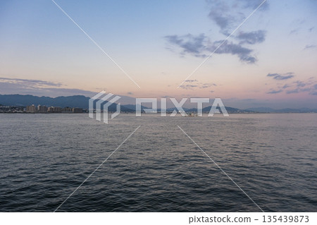Hatsukaichi cityscape seen from Miyajima at dusk Hatsukaichi cityscape seen from Miyajima at dusk 135439873