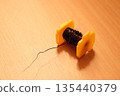 Photo of a coil placed on a desk 135440379