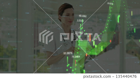 Nurse in scrubs with stethoscope reviewing tablet in hospital corridor, with financial charts Nurse in scrubs with stethoscope reviewing tablet in hospital corridor, with financial charts 135440476