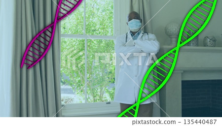 Doctor standing in office wearing coat, stethoscope, mask and gloves with floating DNA graphics Doctor standing in office wearing coat, stethoscope, mask and gloves with floating DNA graphics 135440487