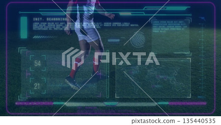 Showing footballer running on grass pitch at night, with AR HUD scanning interface 135440535