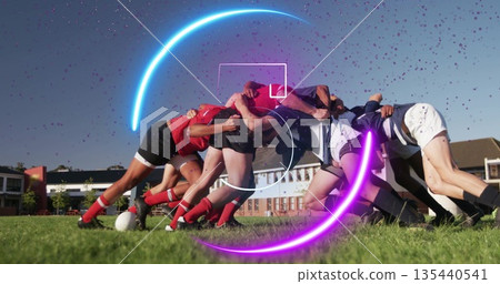 Driving rugby scrum pushing ball on grass field at club, wearing jerseys with neon five countdown Driving rugby scrum pushing ball on grass field at club, wearing jerseys with neon five countdown 135440541