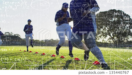 Running female athlete wearing blue jersey weaving through red cones on grass field, practice drill Running female athlete wearing blue jersey weaving through red cones on grass field, practice drill 135440767