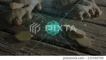 Hovering wireframe sphere over wooden kitchen table with ginger root round slices and digital nodes Hovering wireframe sphere over wooden kitchen table with ginger root round slices and digital nodes 135440799
