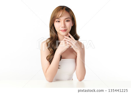 A beautiful young Asian woman with clean, fresh skin against a white background. Skincare, facial treatment, cosmetology, beauty, and spa. An elegant portrait of an Asian woman. A beautiful young Asian woman with clean, fresh skin against a white background. Skincare, facial treatment, cosmetology, beauty, and spa. An elegant portrait of an Asian woman. 135441225
