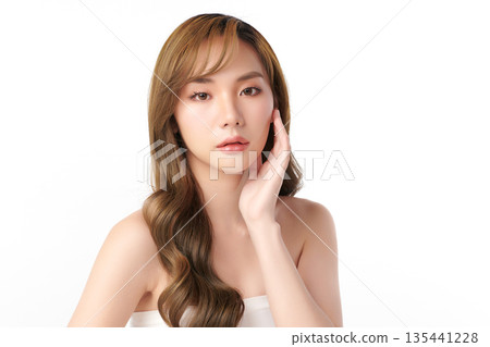 A beautiful young Asian woman with clean, fresh skin against a white background. Skincare, facial treatment, cosmetology, beauty, and spa. An elegant portrait of an Asian woman. A beautiful young Asian woman with clean, fresh skin against a white background. Skincare, facial treatment, cosmetology, beauty, and spa. An elegant portrait of an Asian woman. 135441228