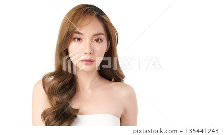 A beautiful young Asian woman with clean, fresh skin against a white background. Skincare, facial treatment, cosmetology, beauty, and spa. An elegant portrait of an Asian woman. A beautiful young Asian woman with clean, fresh skin against a white background. Skincare, facial treatment, cosmetology, beauty, and spa. An elegant portrait of an Asian woman. 135441243