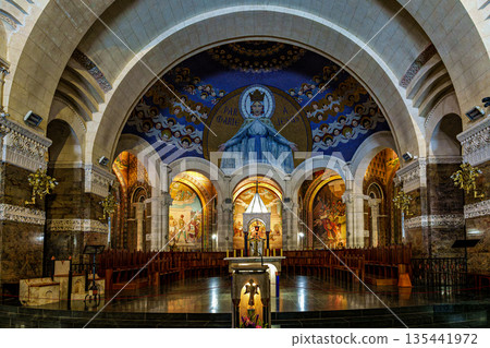 Interior of the Basilica in the Sanctuary of Lourdes, France. 135441972