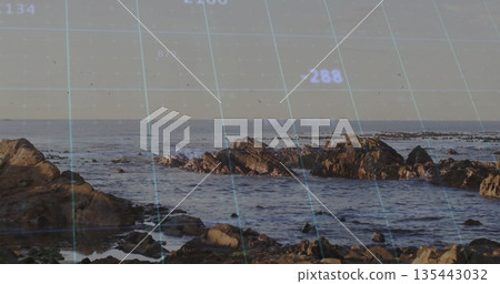 Emerging jagged rock formations breaching shallow water at rocky coast, with digital grid overlay Emerging jagged rock formations breaching shallow water at rocky coast, with digital grid overlay 135443032