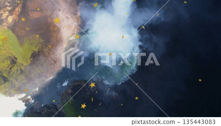 Plunging waterfall spilling over mossy cliff rocks in rocky canyon, swirling mist and yellow stars Plunging waterfall spilling over mossy cliff rocks in rocky canyon, swirling mist and yellow stars 135443083