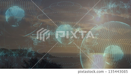 Floating holographic globe drifting above hill and tree line at dusk, with data rings digital lines Floating holographic globe drifting above hill and tree line at dusk, with data rings digital lines 135443085