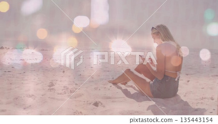 Sitting woman scrolling smartphone on sandy beach at midday with sunglasses and flare, copy space Sitting woman scrolling smartphone on sandy beach at midday with sunglasses and flare, copy space 135443154