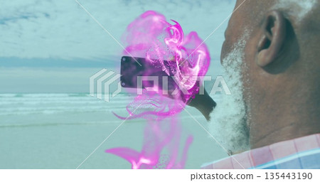 Holding smartphone, man wearing plaid shirt exploring jellyfish AR effect at beach, copy space Holding smartphone, man wearing plaid shirt exploring jellyfish AR effect at beach, copy space 135443190