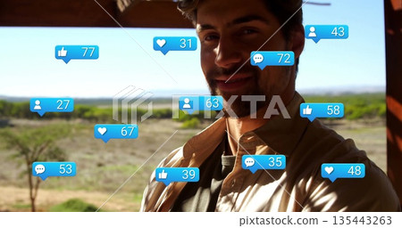 Standing influencer wearing brown shirt at wooden porch, with blue notification icons, copy space 135443263