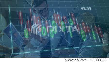 Team in business attire examining charts and laptop in meeting room, with digital overlay 135443306