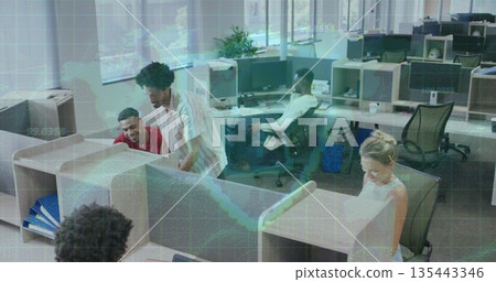 Leaning mid-adult man assisting colleague at open-plan office with monitors and chairs, copy space 135443346