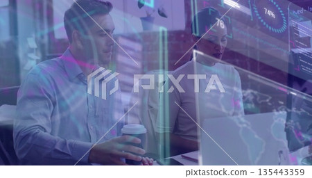 Analyzing colleagues reviewing data charts at conference room desk, with laptop and coffee cup Analyzing colleagues reviewing data charts at conference room desk, with laptop and coffee cup 135443359