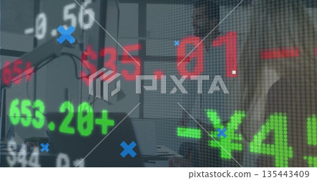 Collaborating professionals in suits analyzing stock figures in office meeting room, with laptops Collaborating professionals in suits analyzing stock figures in office meeting room, with laptops 135443409