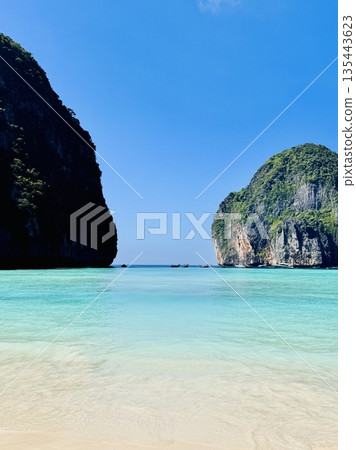 The famous Maya Bay beach with azure waters on the island of Phi Phi in Thailand in the Andaman Sea The famous Maya Bay beach with azure waters on the island of Phi Phi in Thailand in the Andaman Sea 135443623