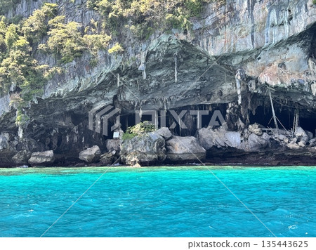 Thailand, Phi Phi Islands November 30, 2025 sightseeing boats with tourists from different countries off the coast of the island Thailand, Phi Phi Islands November 30, 2025 sightseeing boats with tourists from different countries off the coast of the island 135443625