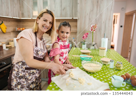 Baking joy fills the kitchen with laughter and creativity Baking joy fills the kitchen with laughter and creativity 135444043