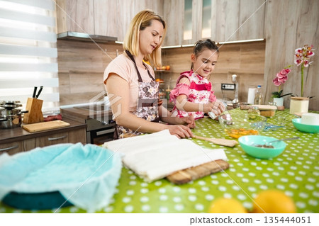 Cooking together in a cozy kitchen on a bright afternoon 135444051