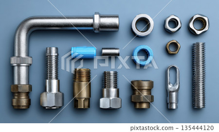 Close-up of metal fittings with threaded surfaces on a white background. The shiny steel parts highlight precision, durability and industrial design used in plumbing and machinery. Selective focus. Close-up of metal fittings with threaded surfaces on a white background. The shiny steel parts highlight precision, durability and industrial design used in plumbing and machinery. Selective focus. 135444120