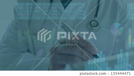 Mature physician tapping tablet and analyzing data in clinic, with stethoscope and charts 135444471