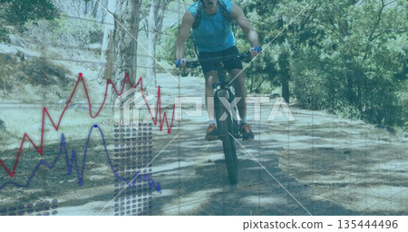 Lifting mountain bike front wheel, male cyclist riding forest trail with gloves and hydration pack Lifting mountain bike front wheel, male cyclist riding forest trail with gloves and hydration pack 135444496
