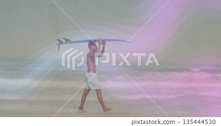 Walking shirtless surfer carrying surfboard overhead at beach with ankle leash and swim trunks Walking shirtless surfer carrying surfboard overhead at beach with ankle leash and swim trunks 135444530